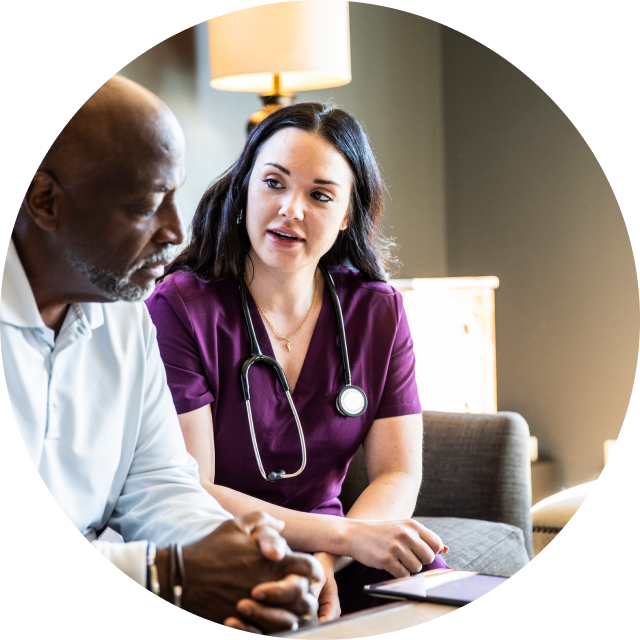 patient speaking with nurse at an appointment