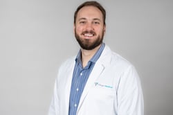 Professional headshot of Ross Sheline, MD